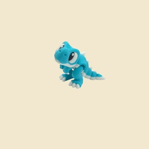 Türkisfarbene Tyrannosaurus-Rex-Miniatur aufrecht mit geöffnetem Maul.